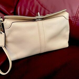Coach clutch purse, buckle closure, 1 inside pocket.  Pink, very good condition
